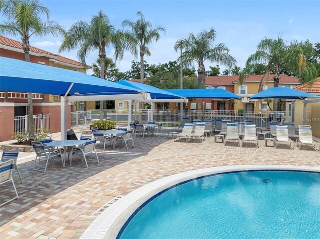 view of swimming pool featuring a patio area