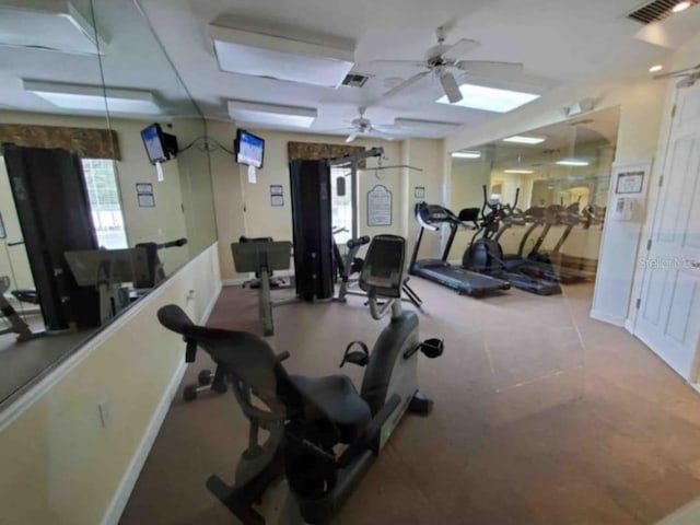 exercise room with ceiling fan