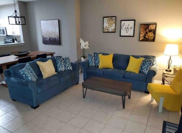 living room featuring a notable chandelier