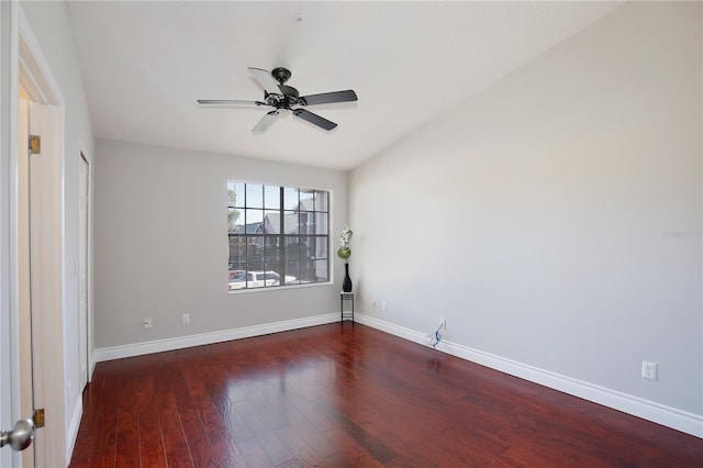 unfurnished room featuring ceiling fan and dark wood-type flooring