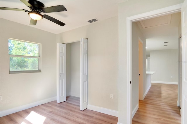 unfurnished bedroom with ceiling fan and light hardwood / wood-style flooring