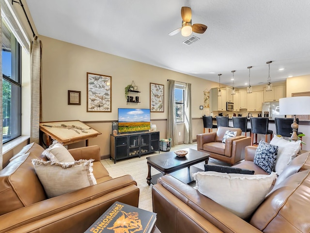 living room featuring ceiling fan