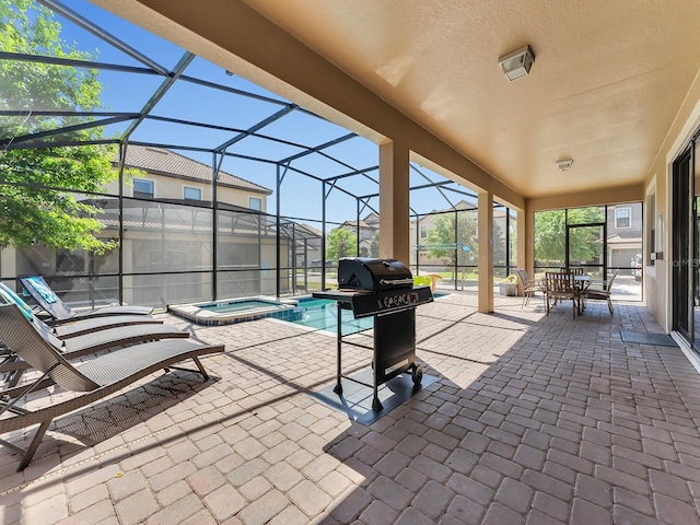 view of patio featuring area for grilling, a swimming pool with hot tub, and a lanai