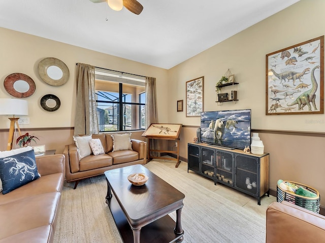 living room featuring ceiling fan and light hardwood / wood-style flooring