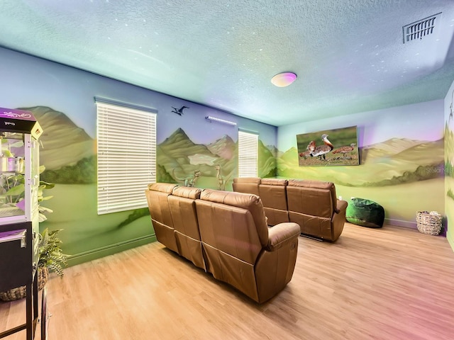 living room featuring hardwood / wood-style floors and a textured ceiling