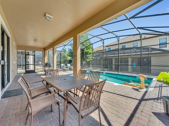 view of patio featuring a lanai