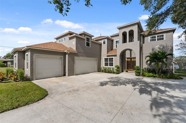 6019 Linneal Beach Dr, Apopka, FL 32703 - mediterranean / spanish-style house with an attached garage, stucco siding, fence, and concrete driveway