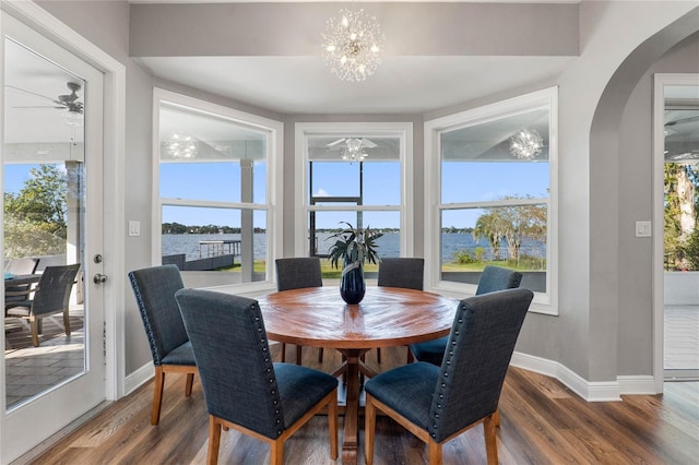 dining space with hardwood / wood-style floors and a wealth of natural light