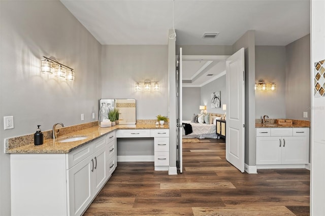 bathroom featuring sink and wood-type flooring