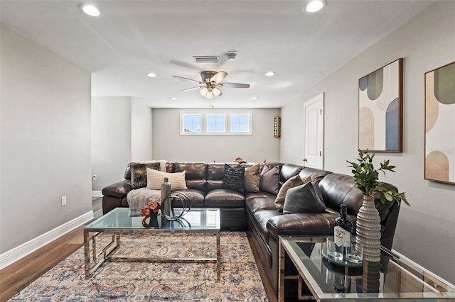 living room with ceiling fan and hardwood / wood-style floors