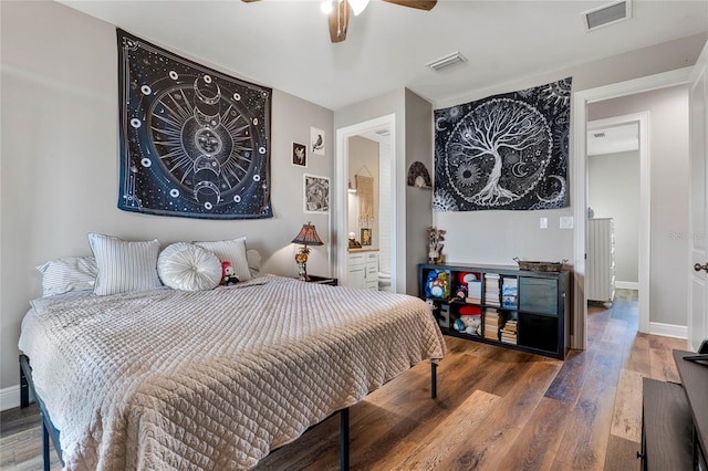 bedroom featuring ensuite bathroom, hardwood / wood-style flooring, and ceiling fan