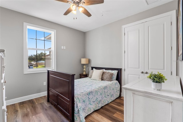 bedroom featuring a closet, ceiling fan, and dark hardwood / wood-style flooring