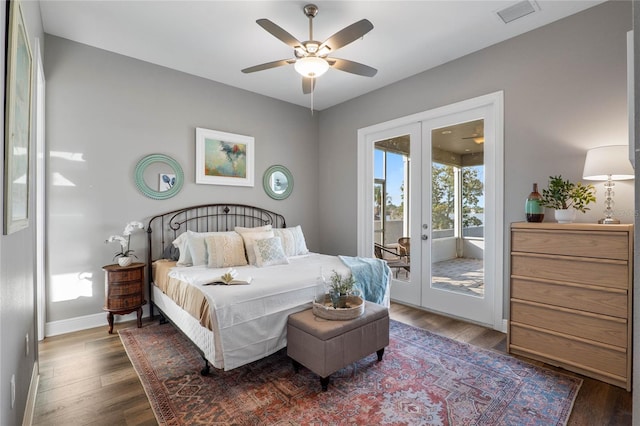 bedroom featuring french doors, ceiling fan, dark wood-type flooring, and access to exterior