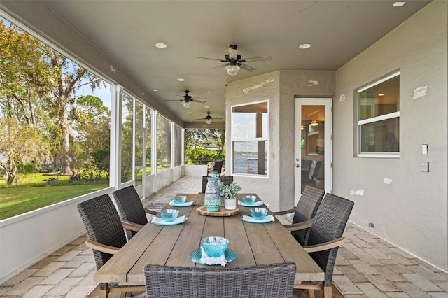 sunroom with ceiling fan