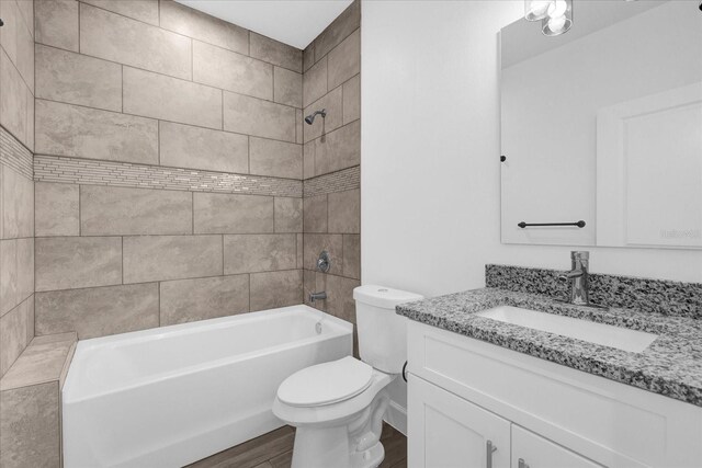 454 Lake Shore Pkwy, Davenport, FL 33896 - bathroom with vanity, toilet, tub / shower combination, and wood finished floors