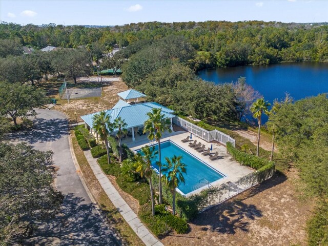 454 Lake Shore Pkwy, Davenport, FL 33896 - view from above of property with a heavily wooded area, a nearby body of water, and a pool area