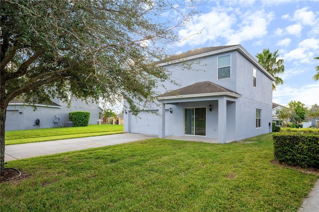 view of front facade with concrete driveway, a front yard, roof with shingles, and stucco siding