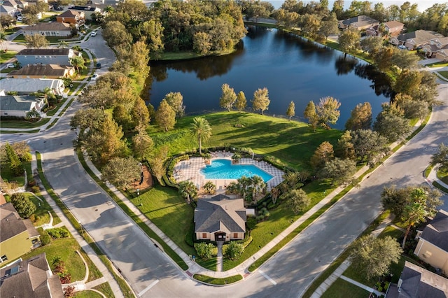 bird's eye view with a water view and a residential view