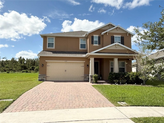 craftsman-style house with a front lawn and a garage