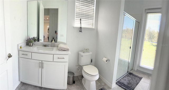 bathroom featuring vanity, toilet, and tile patterned floors