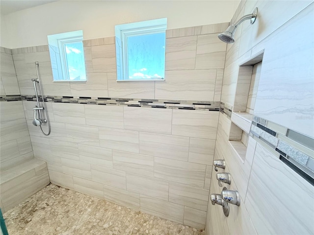 bathroom with a tile shower