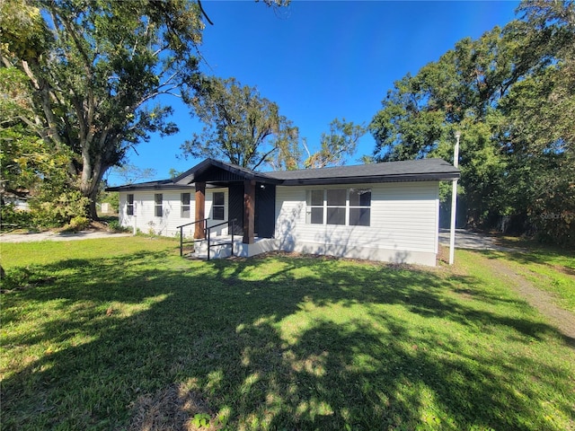 ranch-style house with a front yard