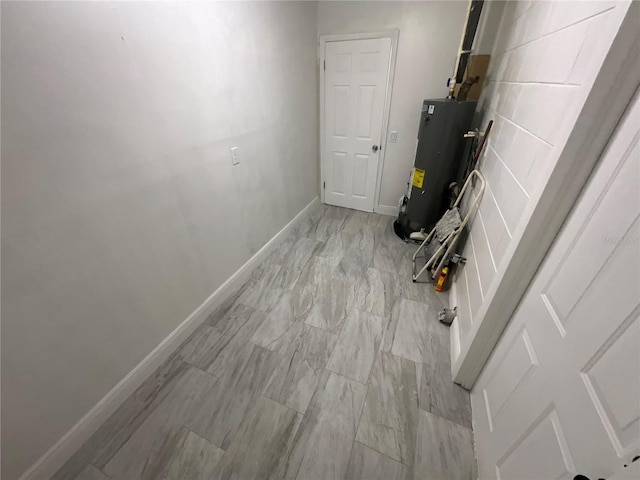 utility room featuring gas water heater