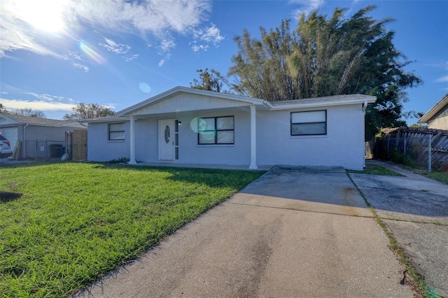 ranch-style home with a front lawn