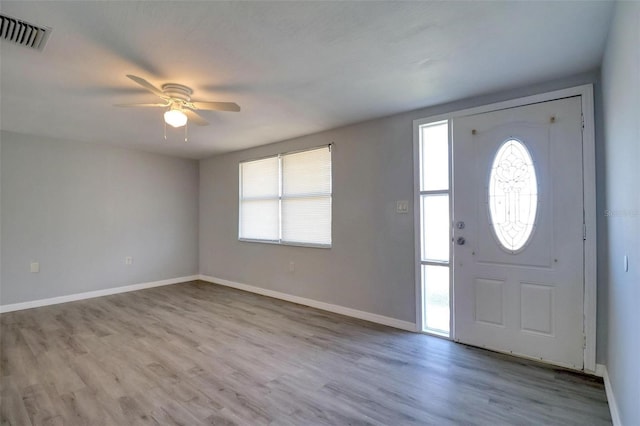 entrance foyer featuring ceiling fan and light wood-type flooring