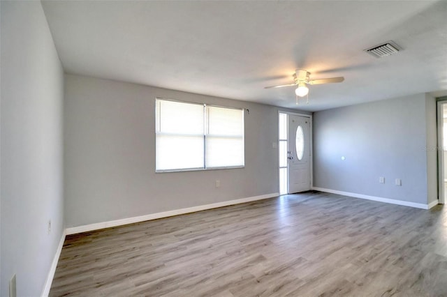 unfurnished room featuring hardwood / wood-style floors and ceiling fan