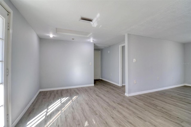 unfurnished room featuring light hardwood / wood-style flooring