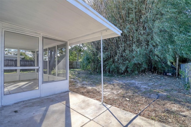 view of patio / terrace with a sunroom