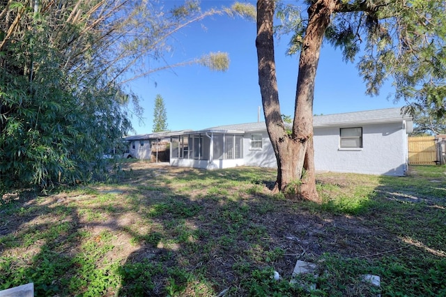 view of yard with a sunroom