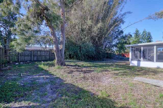 view of yard featuring a sunroom