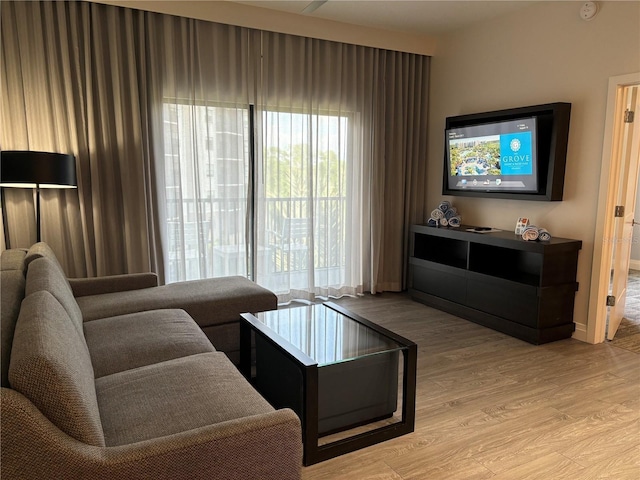 14501 Grove Resort Ave Unit 2608, Winter Garden, FL 34787 - living room featuring light wood-type flooring and baseboards