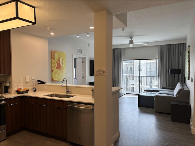 14501 Grove Resort Ave Unit 2608, Winter Garden, FL 34787 - kitchen featuring dishwasher, a sink, open floor plan, a peninsula, and light countertops