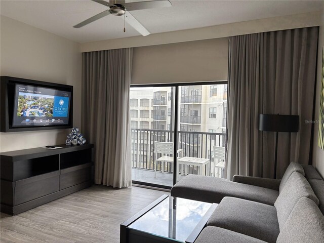 14501 Grove Resort Ave Unit 2608, Winter Garden, FL 34787 - living area featuring ceiling fan and light wood finished floors