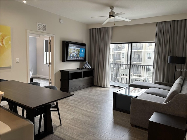 14501 Grove Resort Ave Unit 2608, Winter Garden, FL 34787 - living room featuring ceiling fan and wood finished floors
