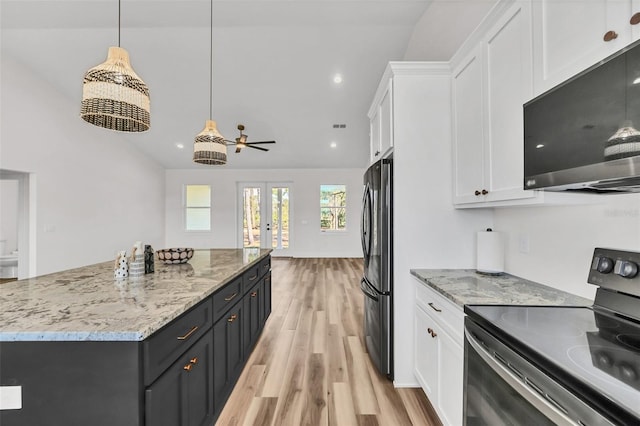 kitchen with a kitchen island, light hardwood / wood-style flooring, white cabinets, pendant lighting, and appliances with stainless steel finishes