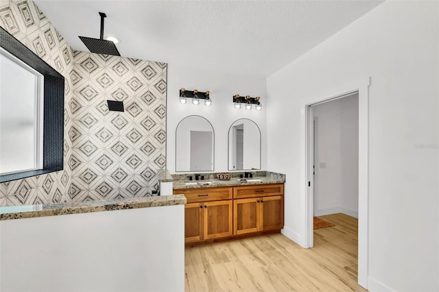 bathroom with vanity, hardwood / wood-style floors, and walk in shower