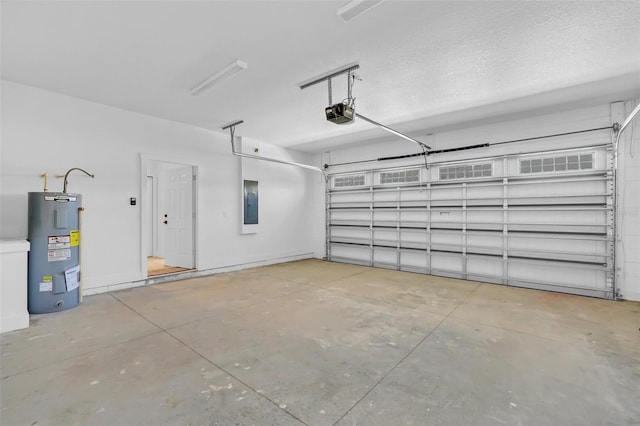 garage with a garage door opener, electric water heater, and electric panel