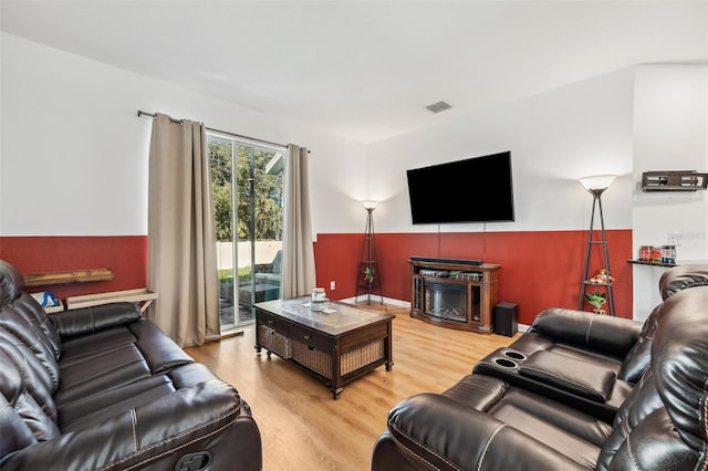 living room with light hardwood / wood-style flooring