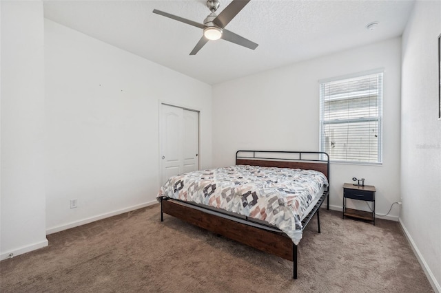 bedroom with carpet flooring, a closet, and ceiling fan