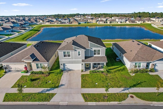 drone / aerial view featuring a water view