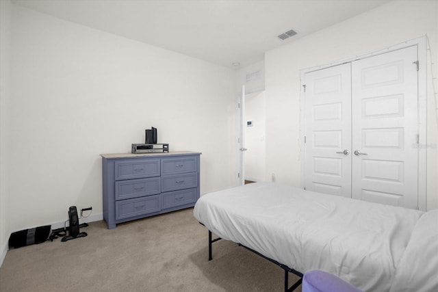 carpeted bedroom featuring a closet