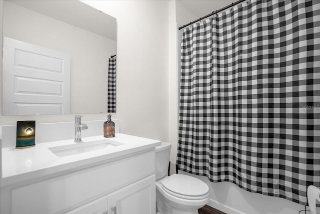 full bathroom featuring vanity, shower / bath combo, and toilet