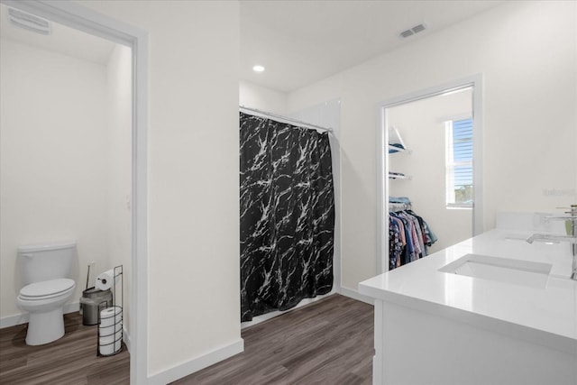 bathroom with vanity, a shower with curtain, wood-type flooring, and toilet