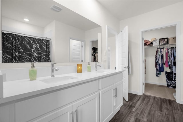 bathroom with vanity and hardwood / wood-style flooring