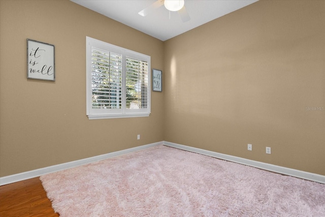 unfurnished room featuring ceiling fan and hardwood / wood-style floors