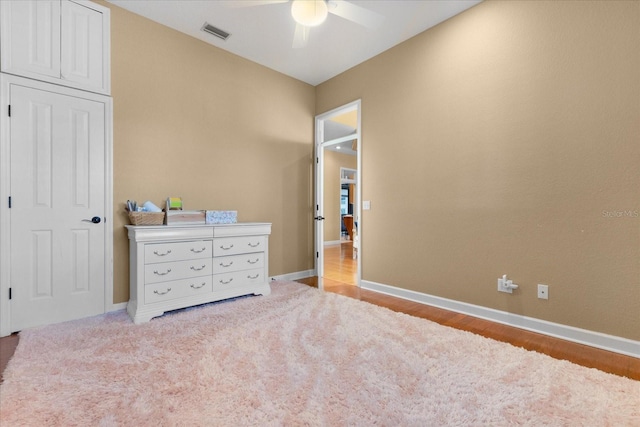 bedroom with ceiling fan and light hardwood / wood-style flooring